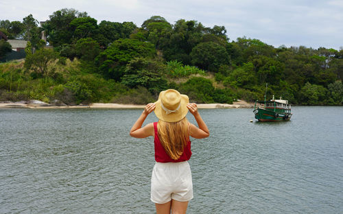 Vacation in south america. back view of tourist girl in vitoria, espirito santo, brazil.