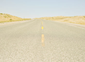 Close-up of road against clear sky