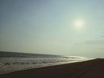 Scenic view of beach against clear sky