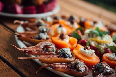 Close-up of fruits in plate on table