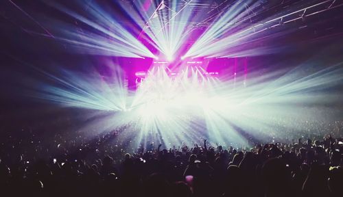 Rear view of people enjoying music concert