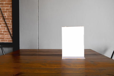 White wooden table against wall