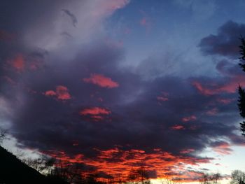 Low angle view of dramatic sky during sunset