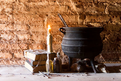 View of fire on log against wall