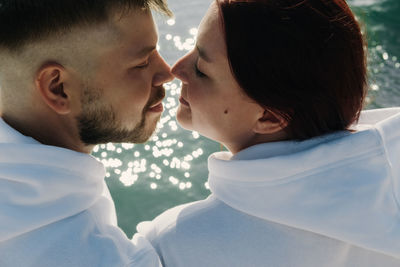 Loving couple on the sea. tender relationship between a man and a woman.