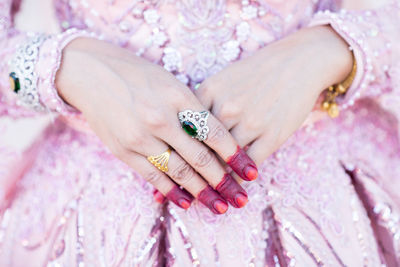Midsection of bride wearing rings