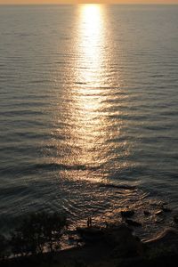 Scenic view of sea against sky at sunset