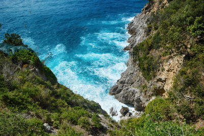 High angle view of rocks by sea