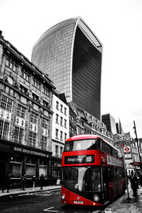 View of city street and buildings against sky