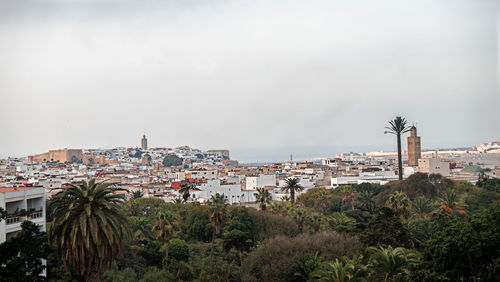 High angle view of buildings in city against sky