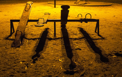 High angle view of silhouette shadow on floor at night