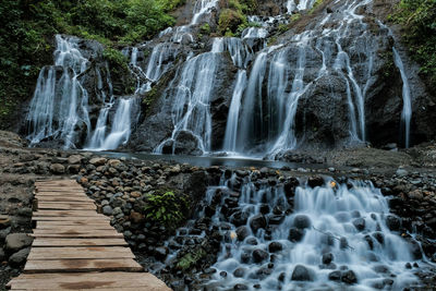 Scenic view of waterfall in forest