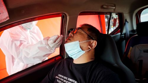 Portrait of man sitting in car