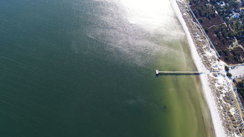 High angle view of sea against trees