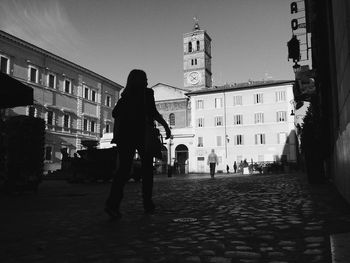 Woman walking on city street