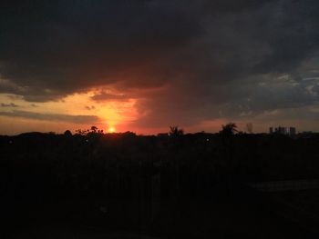 Scenic view of silhouette landscape against sky at sunset