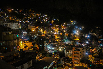 High angle view of city lit up at night