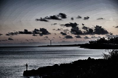 Scenic view of sea against sky at sunset