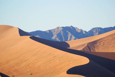 Scenic view of desert against clear sky