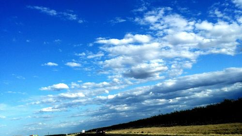 Scenic view of landscape against cloudy sky