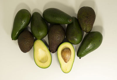 High angle view of fruits over white background