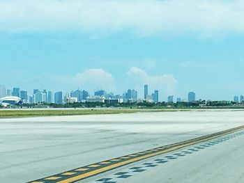 City skyline against cloudy sky