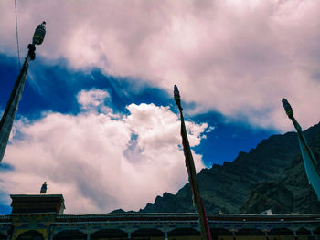 Low angle view of street and building against sky