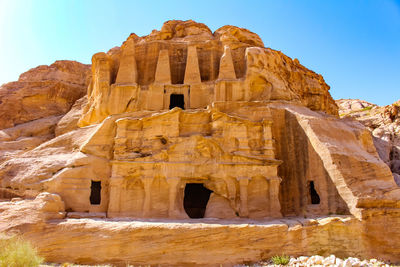 Low angle view of rock formation against clear sky