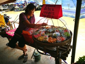Woman at market stall