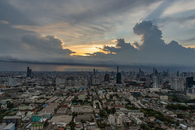 High angle view of buildings against sky during sunset