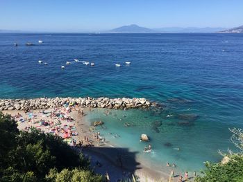 High angle view of sea against blue sky