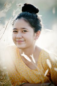 Portrait of a smiling young woman outdoors