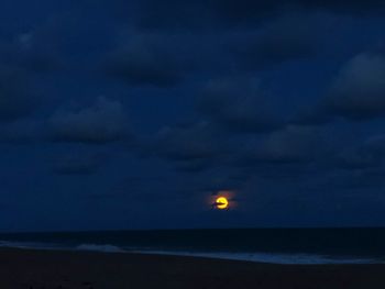 Scenic view of sea against sky at night