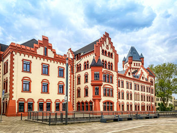 View of buildings against cloudy sky