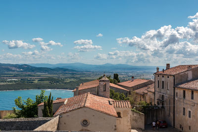 High angle view of buildings in city against sky