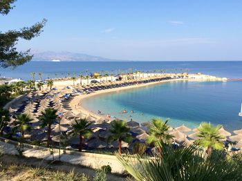 High angle view of swimming pool by sea against sky