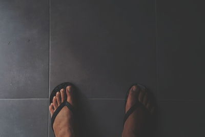 Low section of woman standing on floor