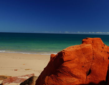 Scenic view of sea against clear blue sky