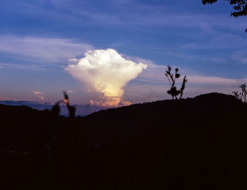 Silhouette landscape against sky during sunset