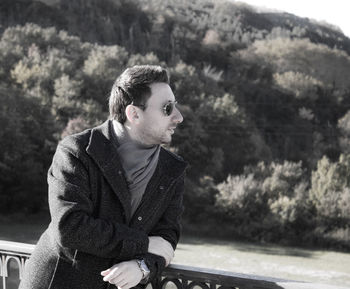 Side view of young man looking away