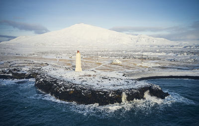 Majestic scenery of lighthouse on rocky coast