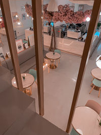 High angle view of empty chairs and table at home