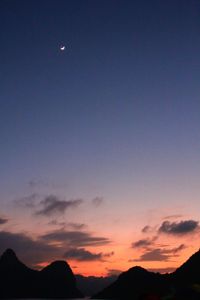 Scenic view of mountains against sky at dusk