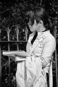 Rear view of girl looking outdoors