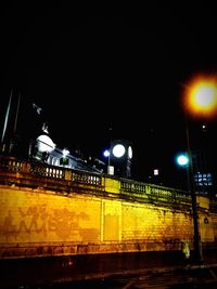 Train on railroad station platform at night