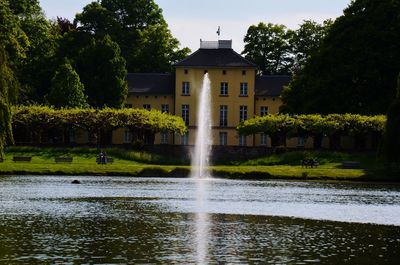 Fountain in garden by building