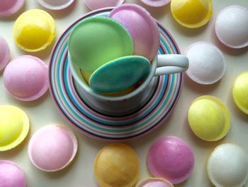 High angle view of flying saucer candies on table