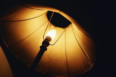 Low angle view of lit lamp