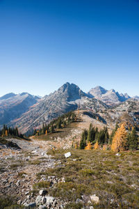 Scenic view of mountains against clear blue sky