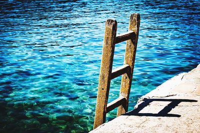 High angle view of railing against sea